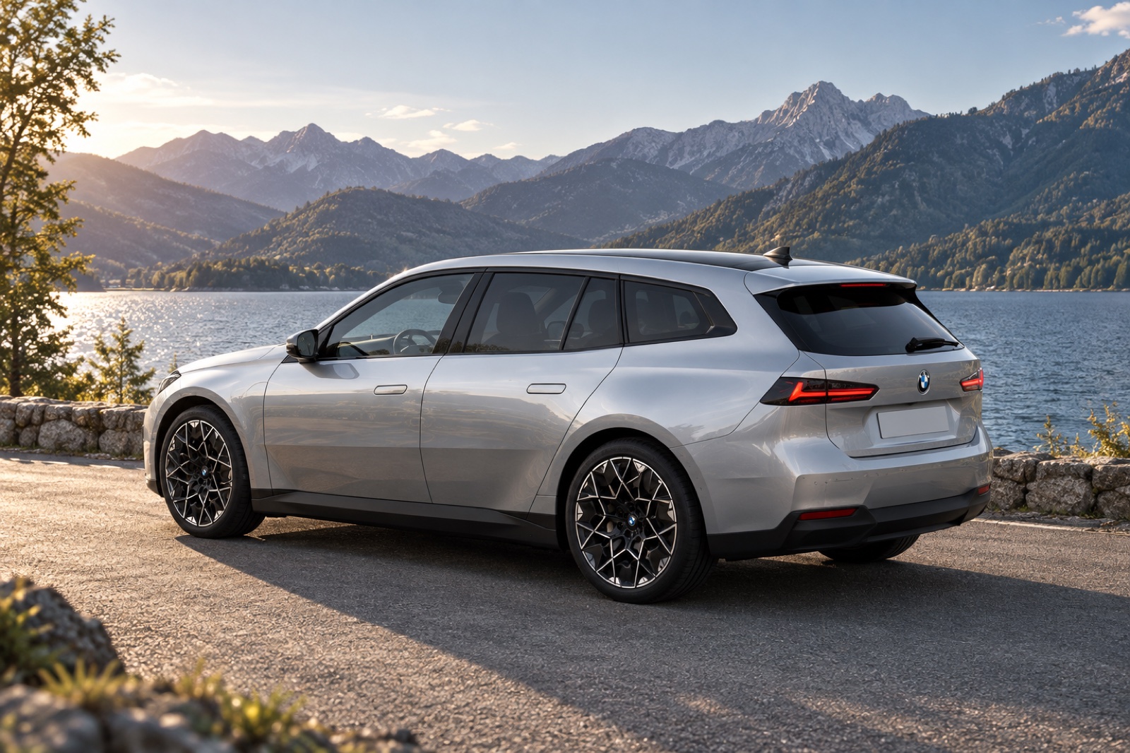 Silver BMW i3 Touring render viewed from the rear beside an alpine lake.